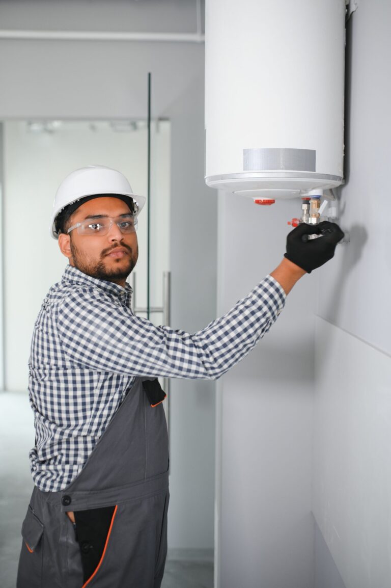 indian plumber using screwdriver while fixing boil 2026 01 09 06 44 37 utc scaled.jpg