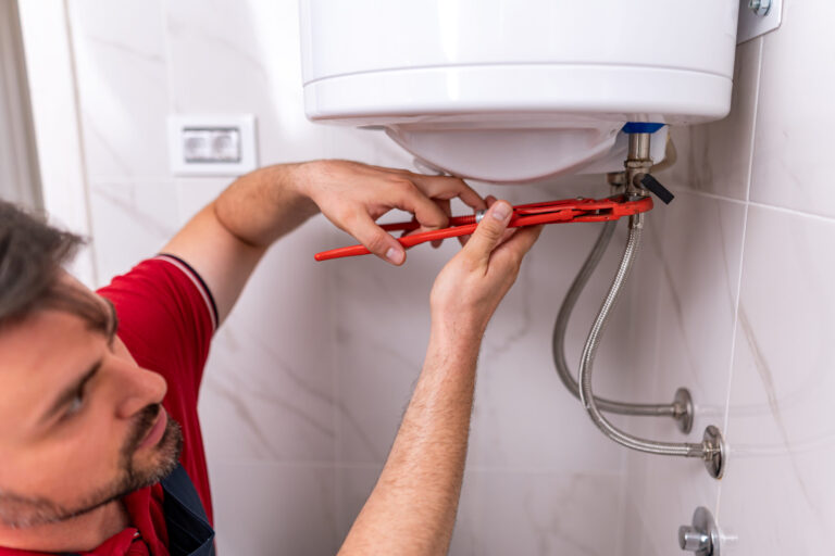 plumber repairing hot water system in modern bathr 2026 03 25 10 05 07 utc scaled.jpg